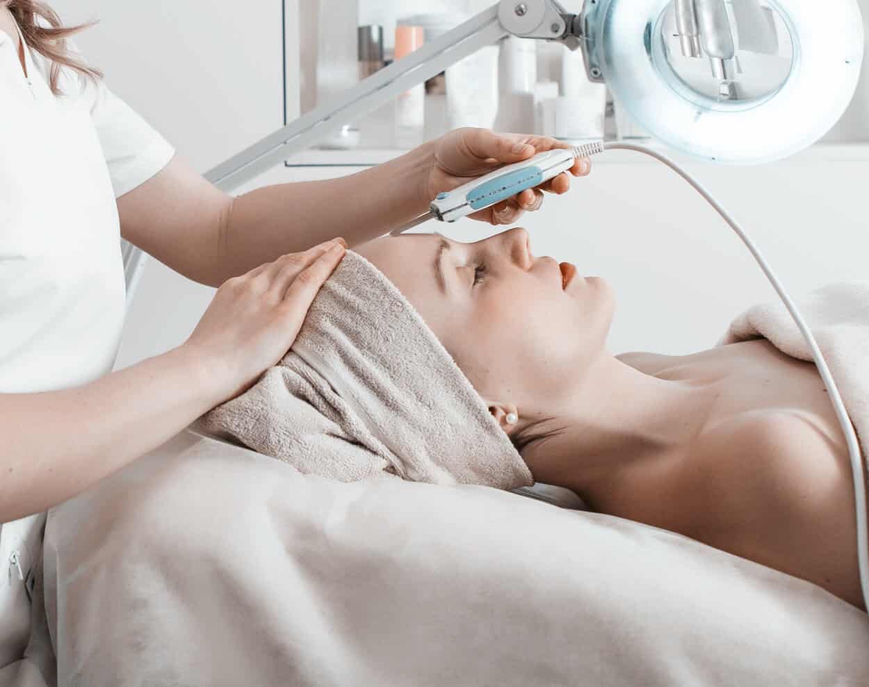 The image shows a woman receiving a Medical Spa treatment.