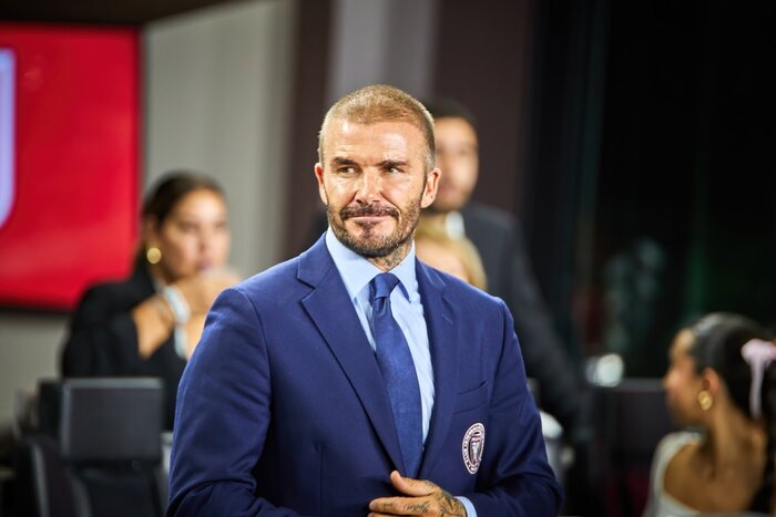  David Beckham with a full head of hair thinning on top