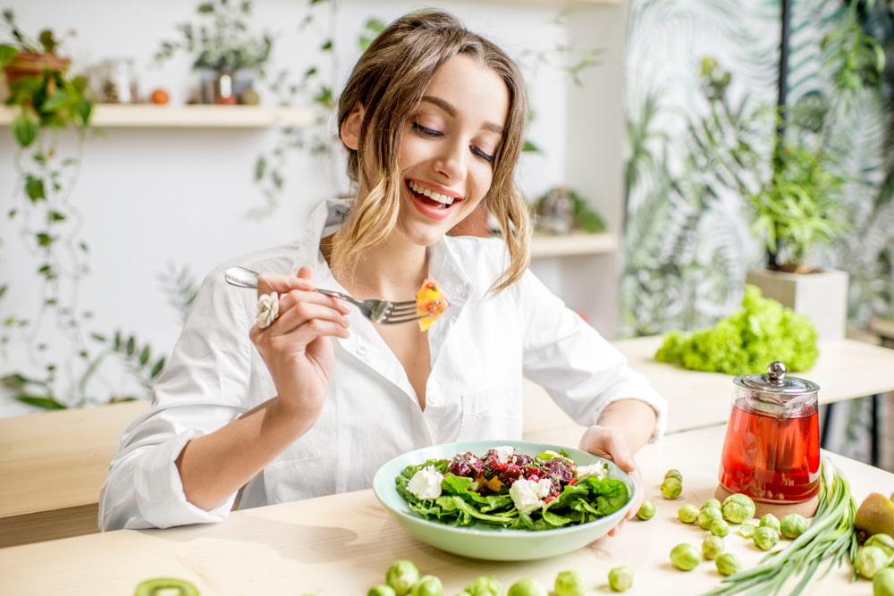 Woman eating salad