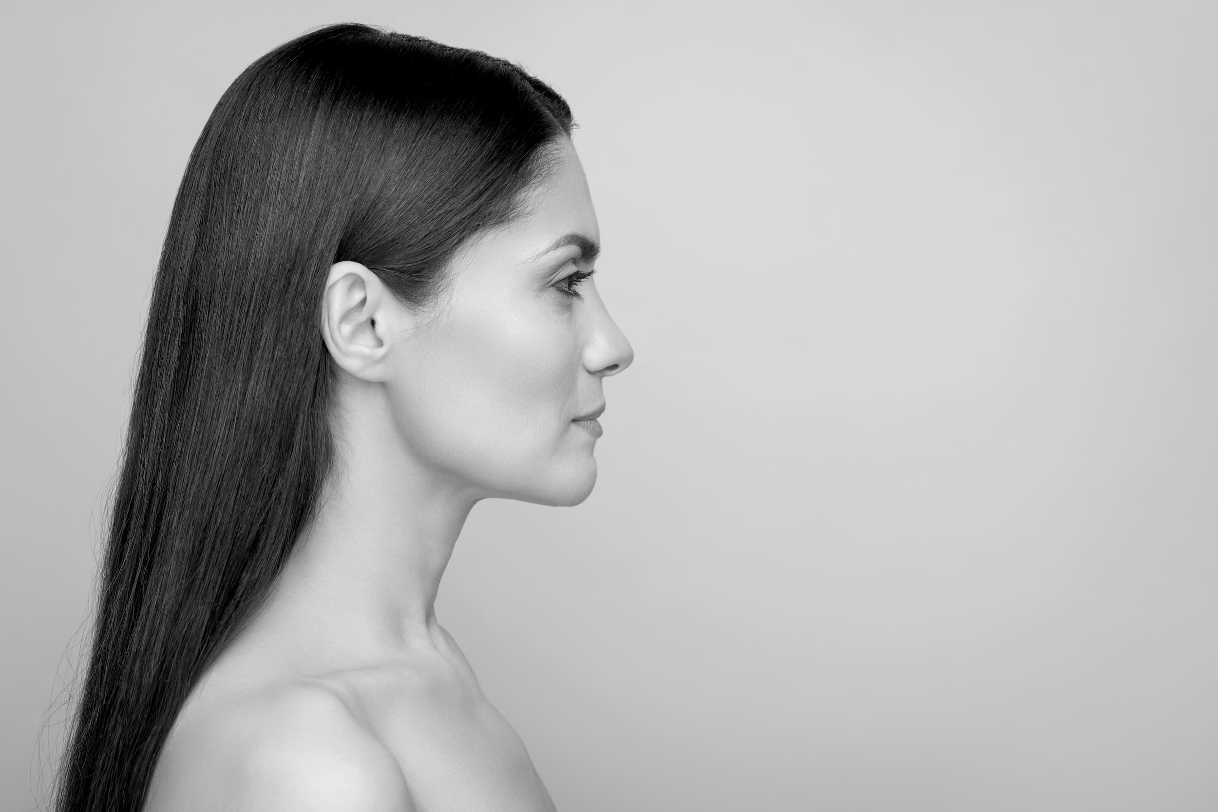 A profile of a young woman with a beautifully defined nose.